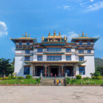 Images 20 **Jirang Monastery: A Spiritual Haven in Odisha, India** Jirang Monastery, nestled amidst the serene hills of Gajapati district in Odisha, stands as a beacon of peace and spirituality. Its vibrant architecture, adorned with intricate Tibetan designs and colorful murals, attracts visitors from far and wide. The monastery, also known as Padmasambhava Mahavihara Monastery, is one of the largest in Eastern India. It offers a tranquil environment for meditation and spiritual retreat, surrounded by lush greenery and picturesque landscapes. Monks in traditional robes can be seen performing rituals and prayers, adding to the monastery's mystical ambiance. Jirang Monastery is not just a place of worship but a cultural hub that showcases the rich heritage of Tibetan Buddhism.